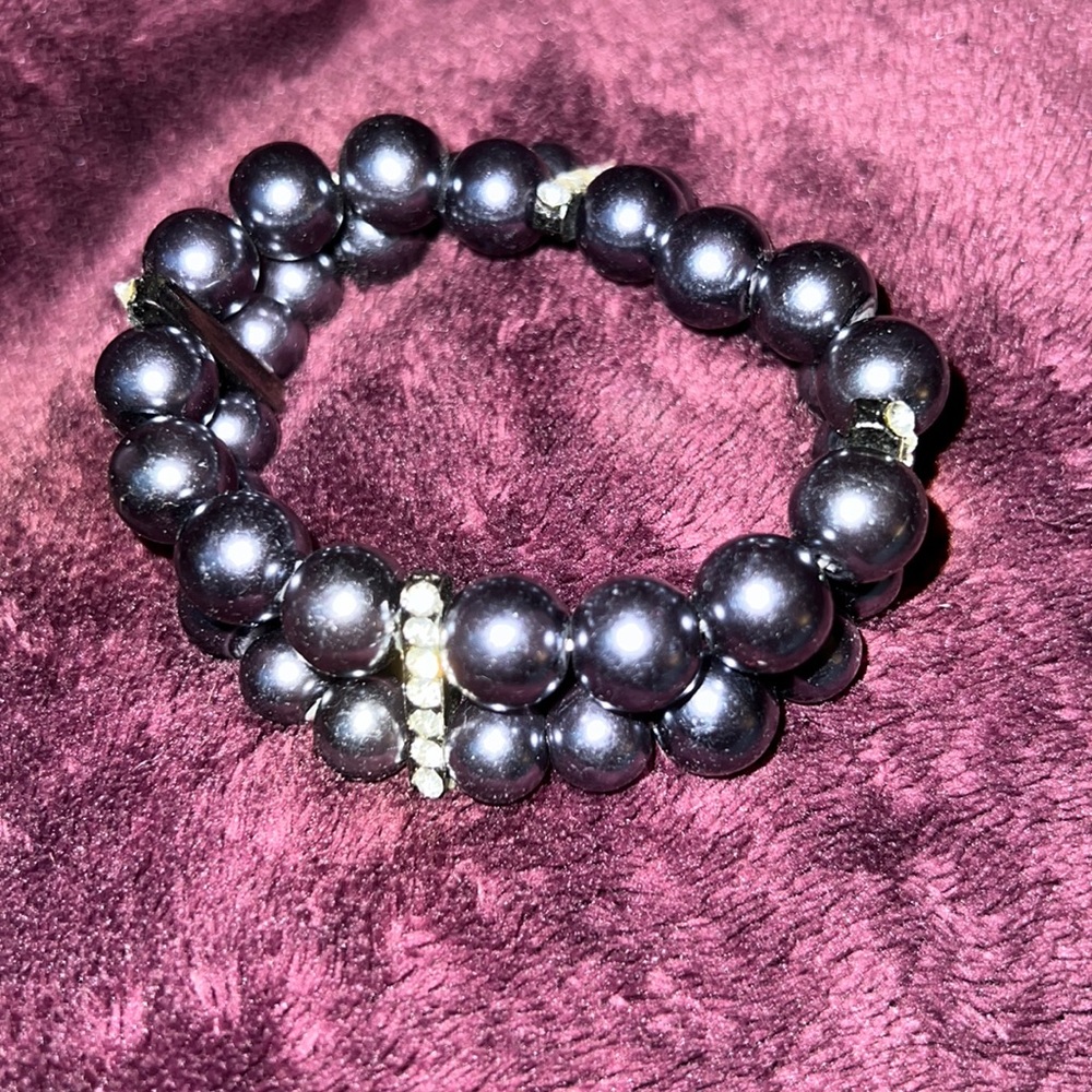 Gunmetal colored beads with strips of clear gems